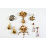 A QUANTITY OF JEWELLERY including a Victorian gold brooch with embossed decoration, 6.5cm long, a