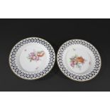 PAIR OF FURSTENBERG PORCELAIN DISHES each plate brightly painted with flowers to the interior,