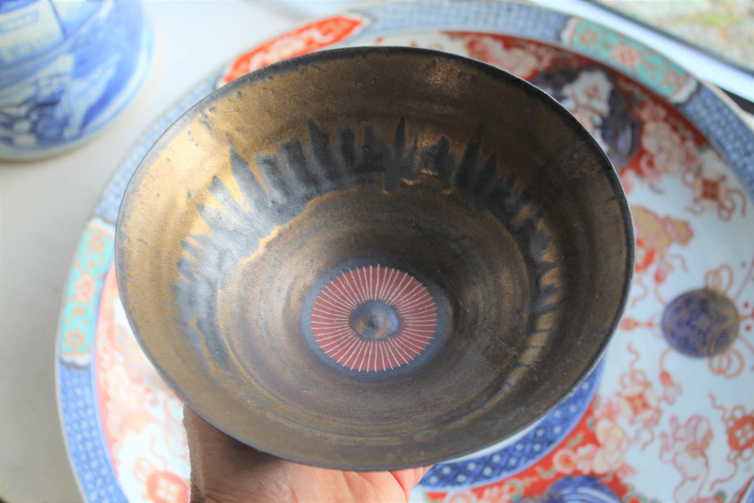 LUCIE RIE (1902-1995) - PORCELAIN BOWL a porcelain footed bowl with a bronze and black drip effect - Image 14 of 20