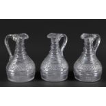 SET OF 3 EARLY 19THC CUT GLASS DECANTER JUGS possibly by Waterford, the top section with