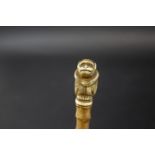 JAPANESE NETSUKE OF A MONKEY - WHANGEE STICK a whangee stick with a bamboo shaft, mounted with a