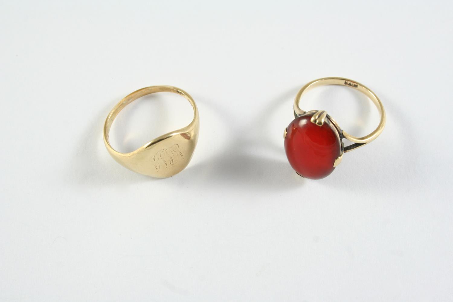 A GOLD SIGNET RING engraved with initials, 3.9 grams, size P, together with a carnelian and 9ct gold