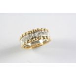 A DIAMOND HALF HOOP RING the ridged two colour gold band is mounted with seven circular-cut