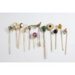 TWENTY SIX ASSORTED STICK PINS a garnet and seed pearl cluster stick pin, a gold stick pin mounted