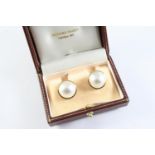 A PAIR OF MABE PEARL AND GOLD STUD EARRINGS each set in a 9ct gold setting.