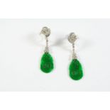 A PAIR OF JADE AND DIAMOND DROP EARRINGS each earring formed with scroll design mount set with a