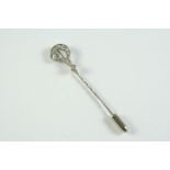 A DIAMOND QUESTION MARK STICK PIN mounted with two collet set old circular-cut diamonds and