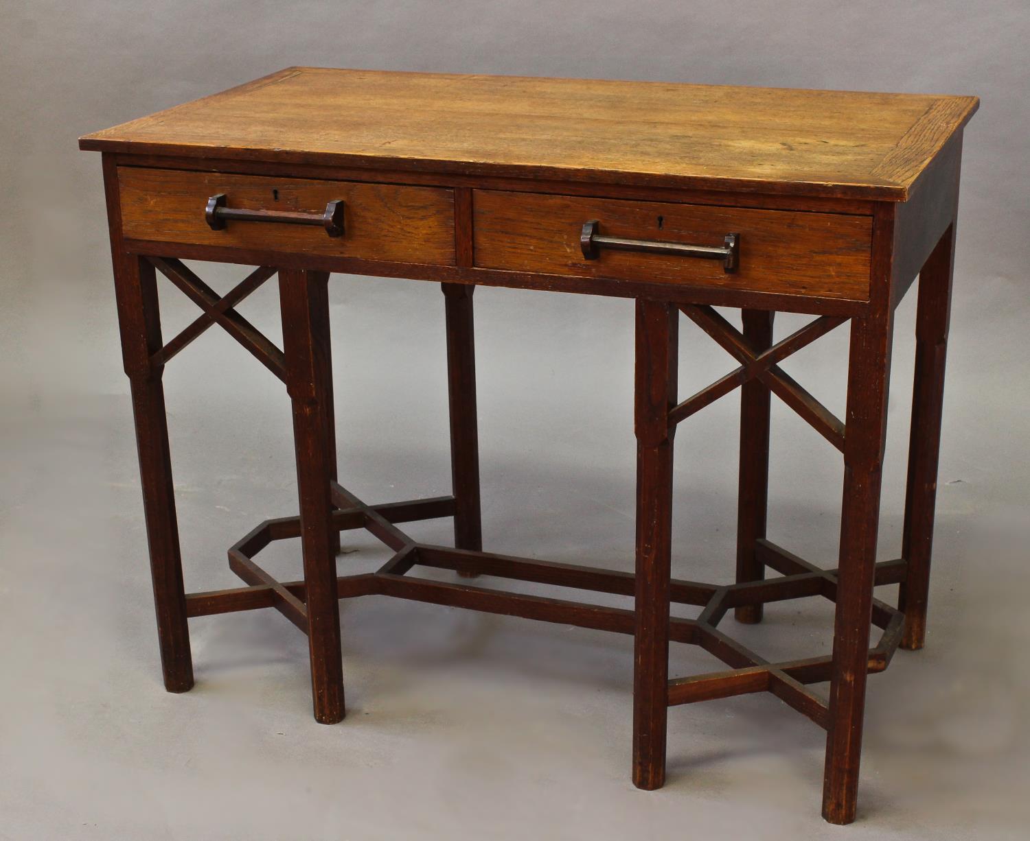 ARTS & CRAFTS SIDE TABLE an unusual table with two drawers and bar handles, supported on eight
