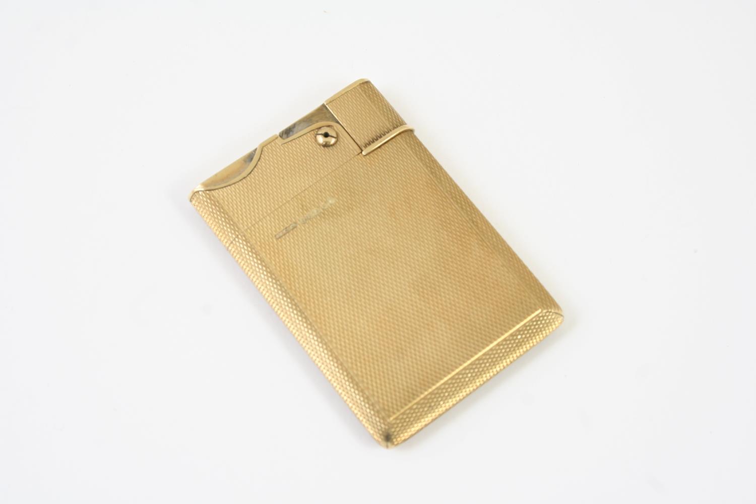 A 9CT GOLD 'WAFER' LIGHTER BY ASPREY & CO with engine turned decoration, marked A & Co. Ltd and