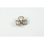 A VICTORIAN MOONSTONE AND DIAMOND SHAMROCK BROOCH formed with three heart-shaped moonstones, each