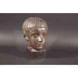 BUST OF A CHILD a bronze coated bust of a child, mounted on a square plinth. Signature to the