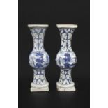PAIR OF DELFT VASES OR PEDESTALS an unusual pair of delft vases or pedestals, of slender form with a