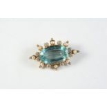 AN AQUAMARINE, DIAMOND AND PEARL BROOCH the oval-shaped aquamarine is set within a surround of