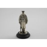 A LATE VICTORIAN FIGURAL INKWELL realistically modelled as a Royal naval sailor in full battle