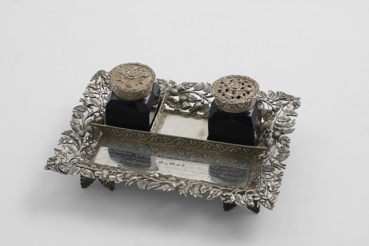 A SMALL EARLY VICTORIAN INKSTAND fitted with two mounted blue glass bottles, the rectangular base