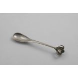 BY THE GUILD OF HANDICRAFTS:- An Edwardian handmade spoon with a drop-shaped bowl, a hammered finish