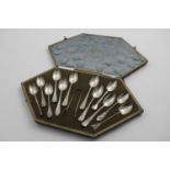 AN UNUSUAL EARLY 20TH CENTURY "TRAVELLING SAMPLE SET" of twelve tea spoons and a pair of sugar