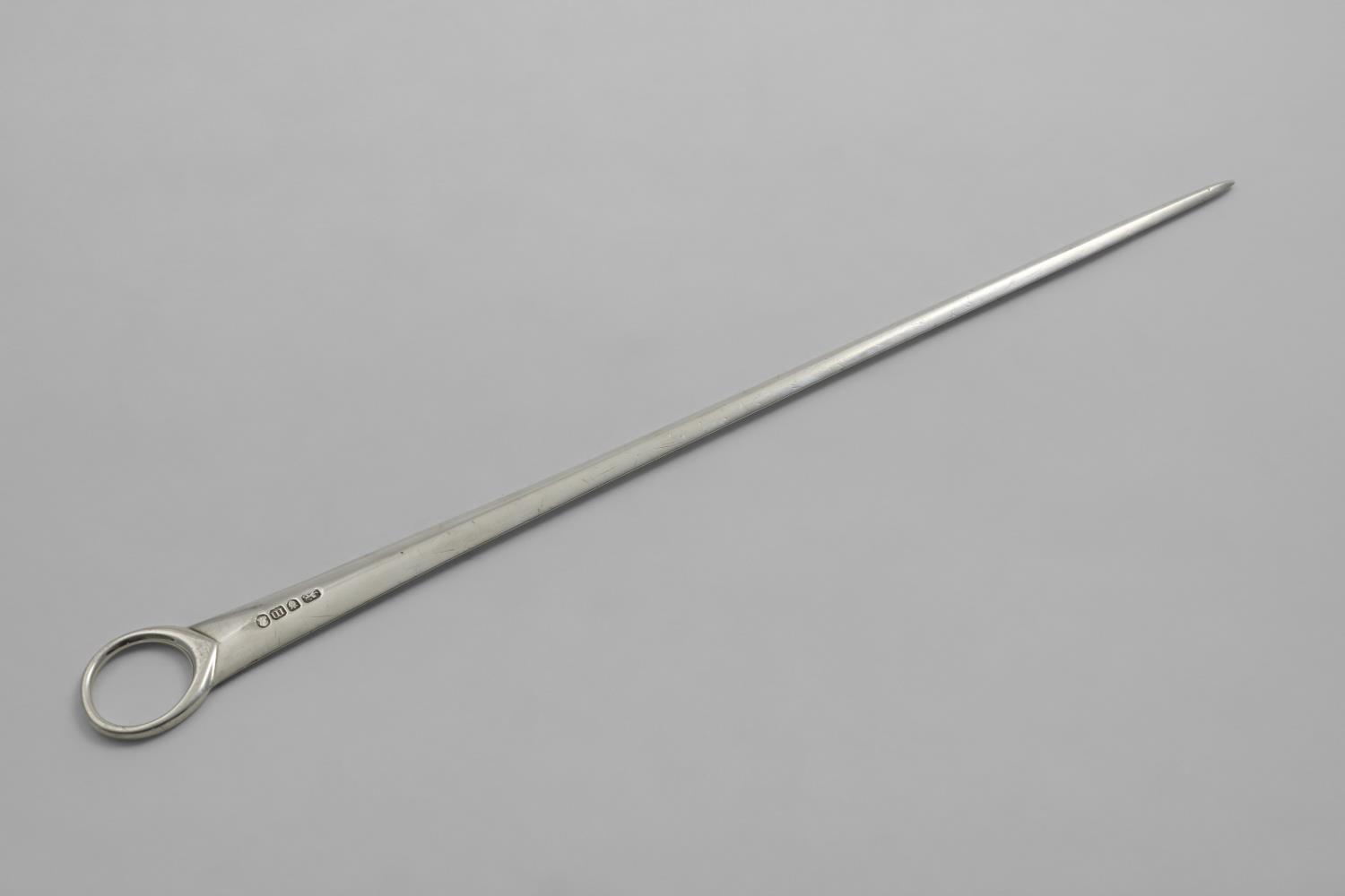 A GEORGE III MEAT SKEWER with a ring handle, maker's mark unclear, London 1787; 13.4" (34 cms) long;