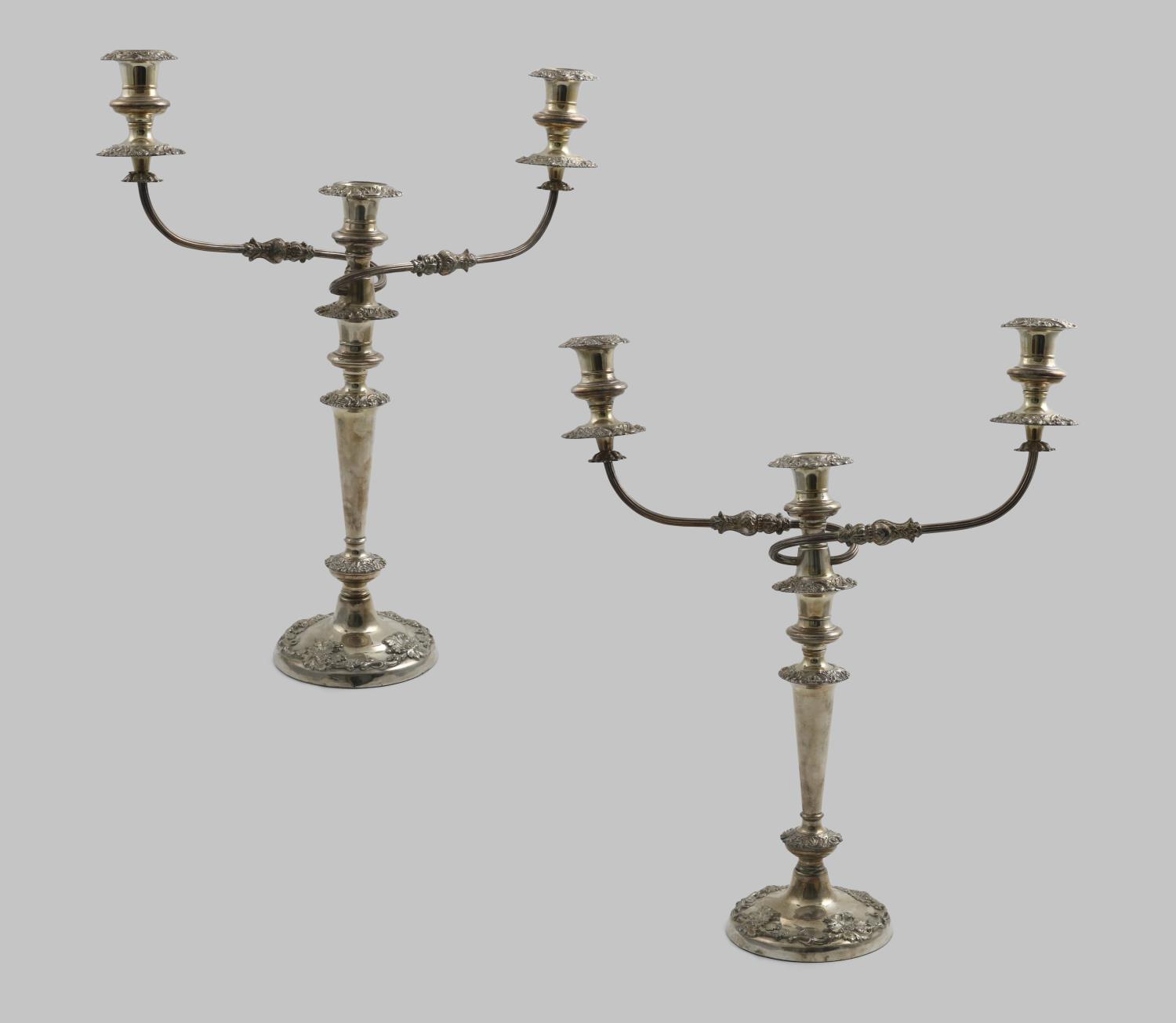 A PAIR OF LATE PERIOD OLD SHEFFIELD PLATED THREE-LIGHT CANDELABRA with plain tapering columns,