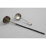 A GEORGE I / II PUNCH LADLE with an egg-shaped bowl and a shaped rim, chased with three stylised