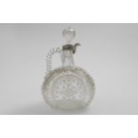 A VICTORIAN MOUNTED CUT-GLASS WINE DECANTER & STOPPER in the form of a circular flask with a twist-