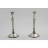 A PAIR OF EARLY 19TH CENTURY AUSTRO-HUNGARIAN CANDLESTICKS on rising circular bases with tapering