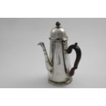 AN EARLY 18TH CENTURY LARGE TAPERING COFFEE POT with a side handle, a moulded foot ring and a high-