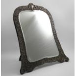 A LATE VICTORIAN LARGE TOILET MIRROR shaped rectangular with an arched top section and an easel