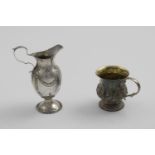 A GEORGE III VASE-SHAPED CREAM JUG with punch-beaded borders and chased festoons, fluting and a