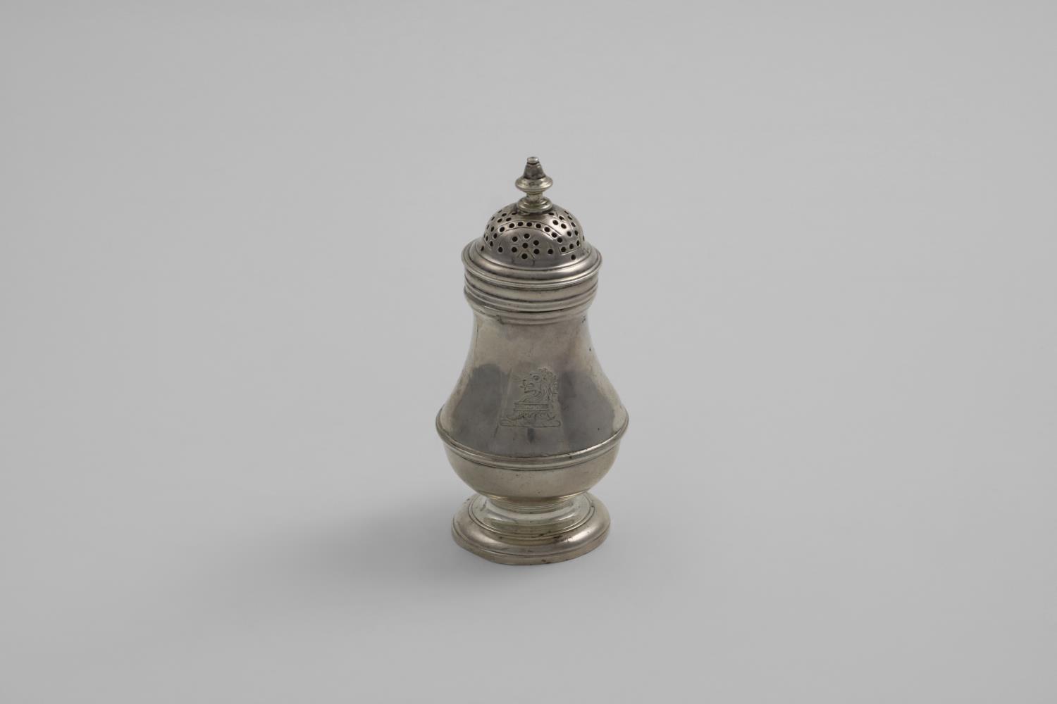 A GEORGE II BALUSTER PEPPER CASTER the bun cover with a knop finial, incised underneath with the