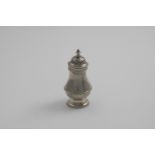 A GEORGE II BALUSTER PEPPER CASTER the bun cover with a knop finial, incised underneath with the