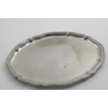 AN EARLY 20TH CENTURY GERMAN TRAY OR SALVER of shaped oval outline; 15.3" (39 cms) long; 29.7 oz