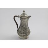 A GEORGE III BALUSTER HOT WATER JUG with repousse-work decoration; chinoiserie figures & flowers,