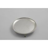 A GEORGE III SCOTTISH WAITER OR STAND plain circular with a bead border and three plain feet,