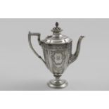 A VICTORIAN ENGRAVED COFFEE POT in the form of a vase on a circular pedestal foot, the cover with