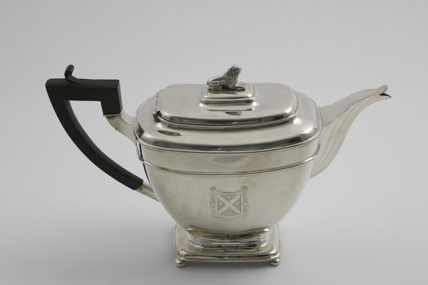 A VICTORIAN SCOTTISH PROVINCIAL TEA POT of rounded rectangular form on button feet, with a fluted