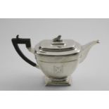 A VICTORIAN SCOTTISH PROVINCIAL TEA POT of rounded rectangular form on button feet, with a fluted