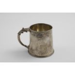 A MID 20TH CENTURY HANDMADE MUG with a tapering body, hammered finish and a cast reed and foliate