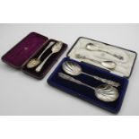 A LATE VICTORIAN CASED PAIR OF DECORATIVE, FRUIT SERVING SPOONS with fluted bowls, by Messrs.