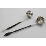 A LATE GEORGE II DOUBLE-LIPPED PUNCH LADLE with a turned wooden handle and an embossed bowl,