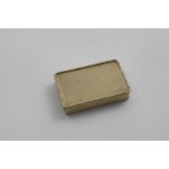 A MID 20TH CENTURY 9ct GOLD SNUFF BOX rectangular with engine-turned decoration and a raised
