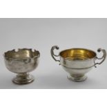 AN EARLY 20TH CENTURY ROSE BOWL with a shaped and moulded rim, by H.C. Davis, Birmingham 1921 and an