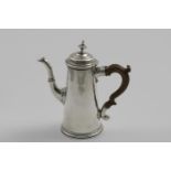 A GEORGE I SMALL TAPERING COFFEE POT with a domed cover, knop finial and a wooden scroll handle,