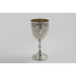 A VICTORIAN EMBOSSED GOBLET with classical portraits in relief around the sides and a vacant