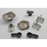 A MIXED LOT:- A pair of small toast racks by the Goldsmiths & Silversmiths Co.Ltd., London 1923, a