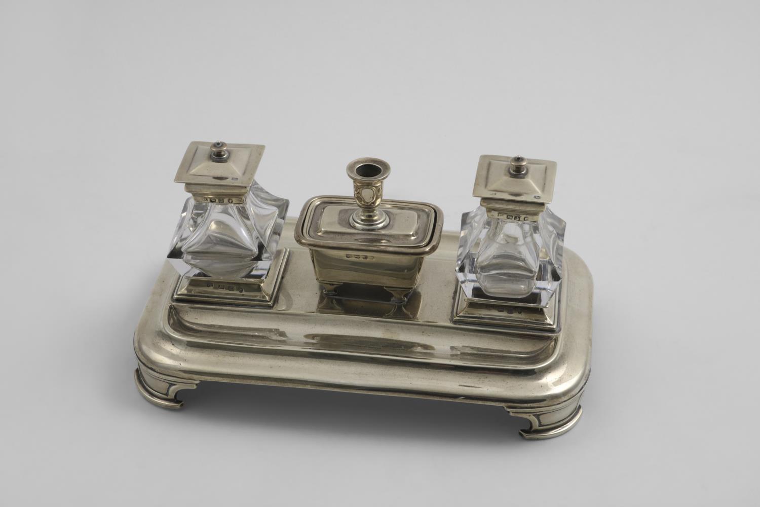 A VICTORIAN RECTANGULAR INKSTAND with rounded corners, bracket feet and two pen depressions,