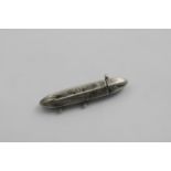 JUDAICA:- A torpedo-shaped mezuzah of hexagonal outline with engraved text/script along the