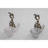 A PAIR OF VICTORIAN PARCELGILT MOUNTED ROCK CRYSTAL SALTS with two bowls and a central cast