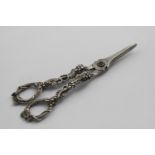 A PAIR OF EARLY VICTORIAN CAST GRAPE SHEARS with pierced vine handles, initialled on the reverse, by