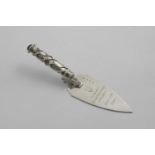 BY OMAR RAMSDEN:- An early 20th century small presentation trowel, inscribed on the blade "M.